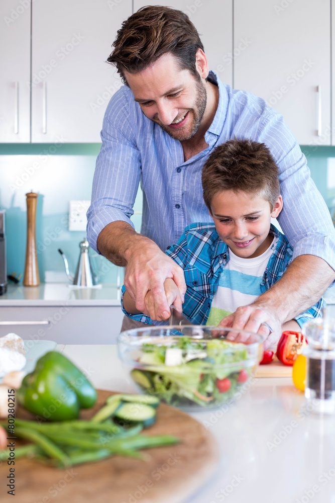 Happy family preparing vegetables together Happy family preparing vegetables together