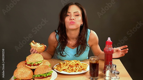 Woman eating fast food.Time lapse.