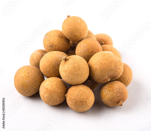 Longan fruit over white background