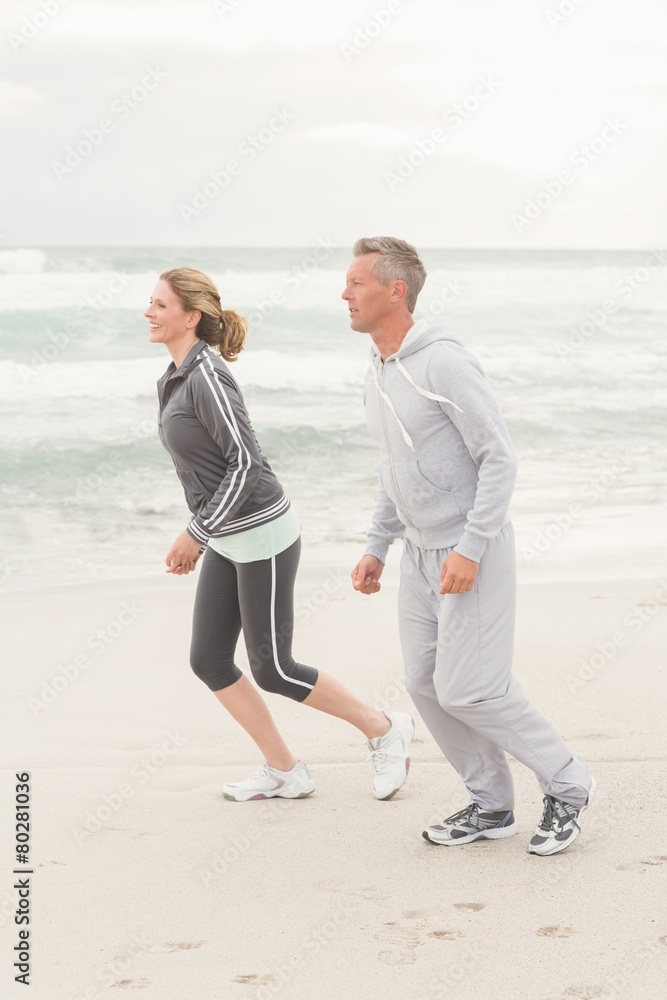 Fit couple jogging together Fit couple jogging together