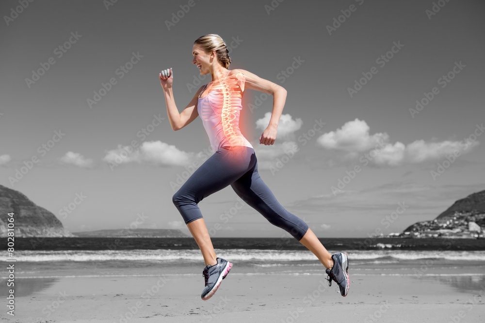 Highlighted back bones of jogging woman on beach Highlighted back bones of jogging woman on beach