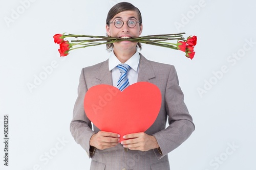 Geeky businessman offering valentines gifts