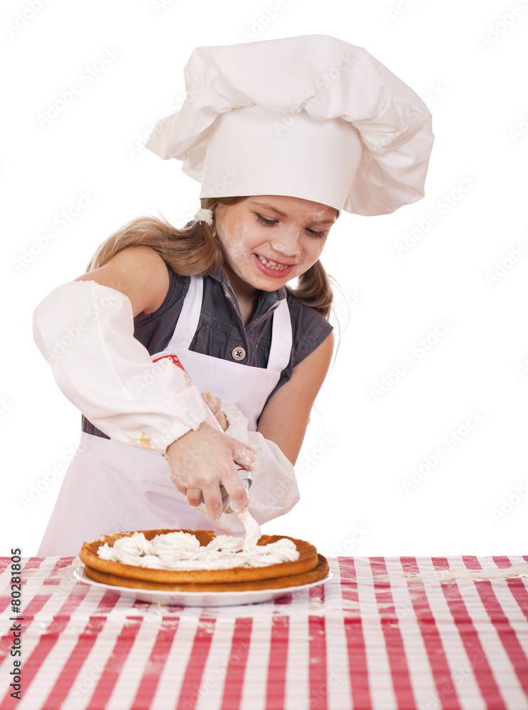Beautiful happy seven year old girl in chef uniform with shortca Beautiful happy seven year old girl in chef uniform with shortca