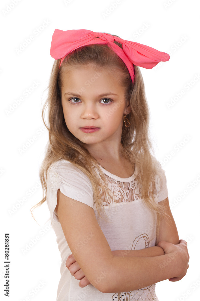 Portrait of a little girl with a red bow on her head Portrait of a little girl with a red bow on her head