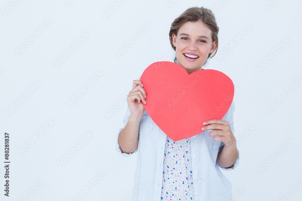 Woman holding heart card