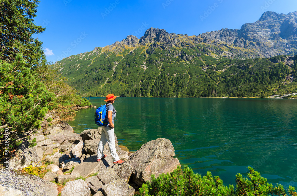 Woman tourist at Morskie Oko lake in summer, Tatra Mountains