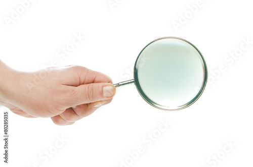 hand with magnifying glass