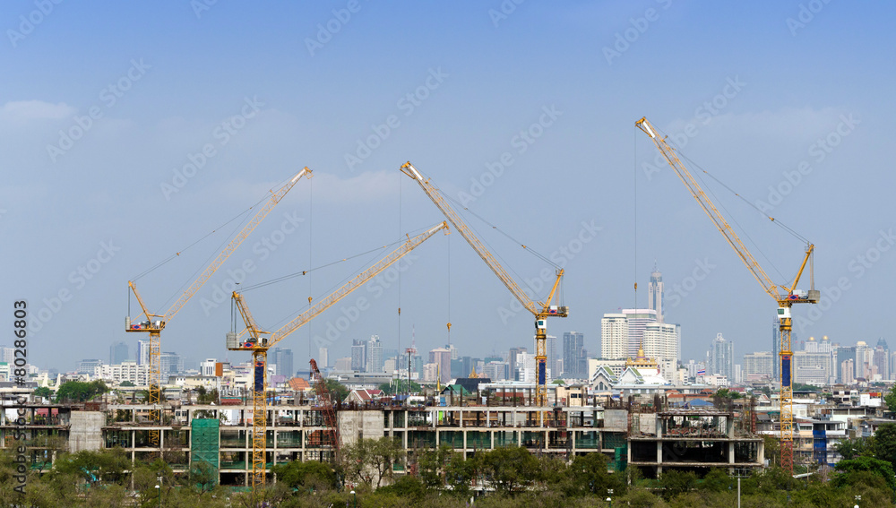 Building and cranes under construction