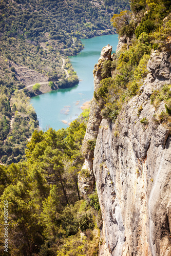 View of cliff and river flowing below near Siurana, Spain