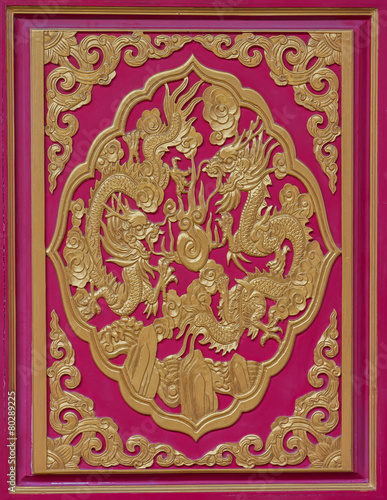 Wood carved dragon on the wall of the temple, Thailand.