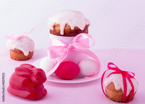 Decorated easter cakes and eggs in pink pastel colours. Selecti