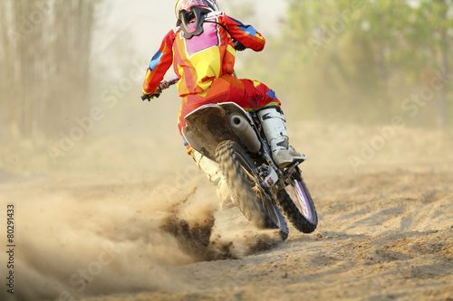 motocross racer accelerating speed in track