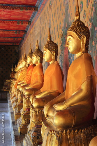 meditation buddha statues in bangkok focus on right statue photo