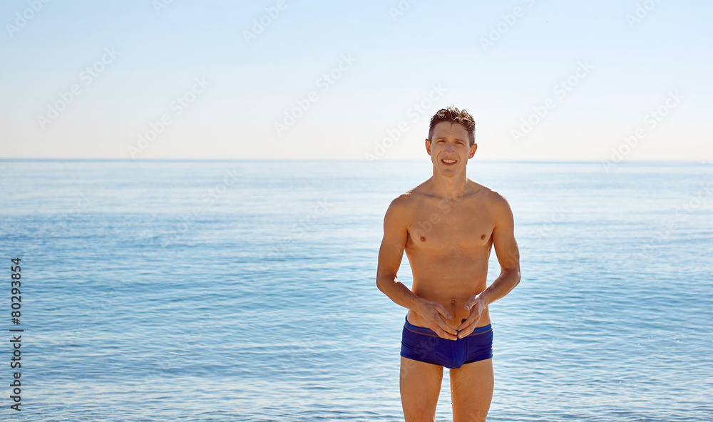 young man on the sea background