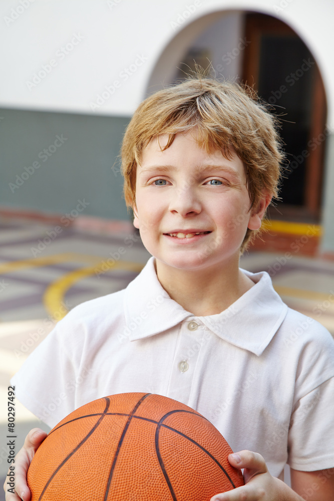 Child with basketball in physical education class Child with basketball in physical education class