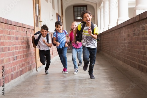 Fotografie Cute pupils running down the hall