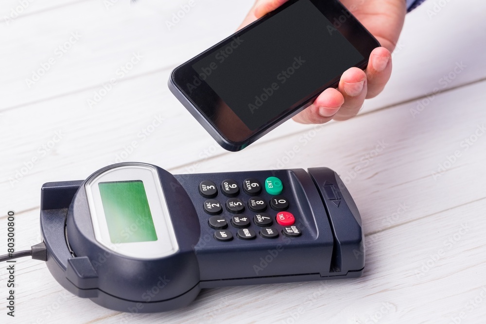 Man using smartphone to express pay Man using smartphone to express pay