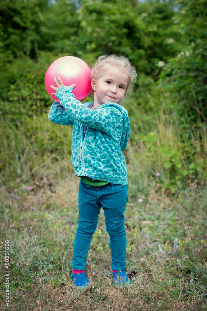 happy little girl playing with ball happy little girl playing with ball