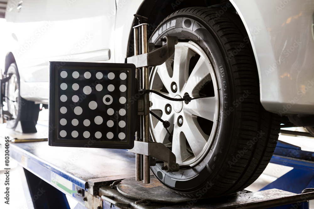 Fototapeta premium Wheel balancing of a vehicle in progress