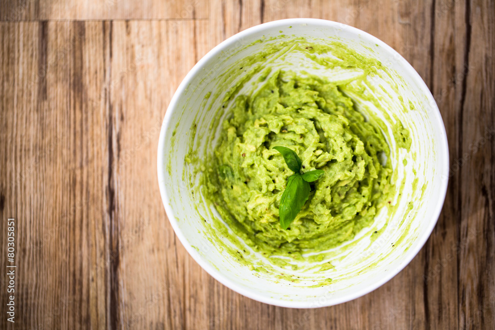 Fresh avocado guacamole on rice bred with basil Fresh avocado guacamole on rice bred with basil