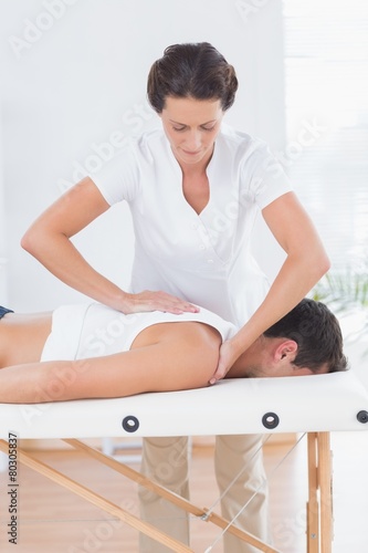 Physiotherapist doing back massage