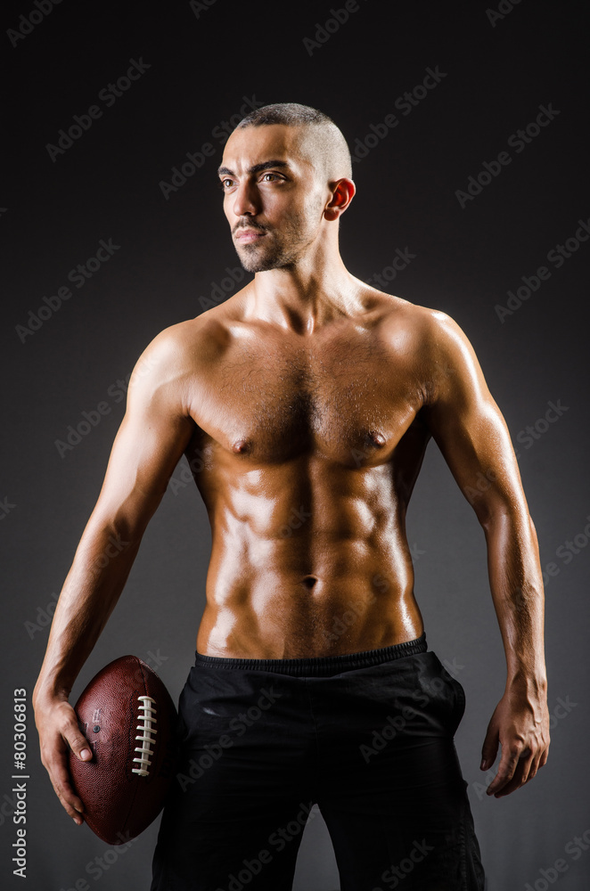 Muscular football player with ball Muscular football player with ball