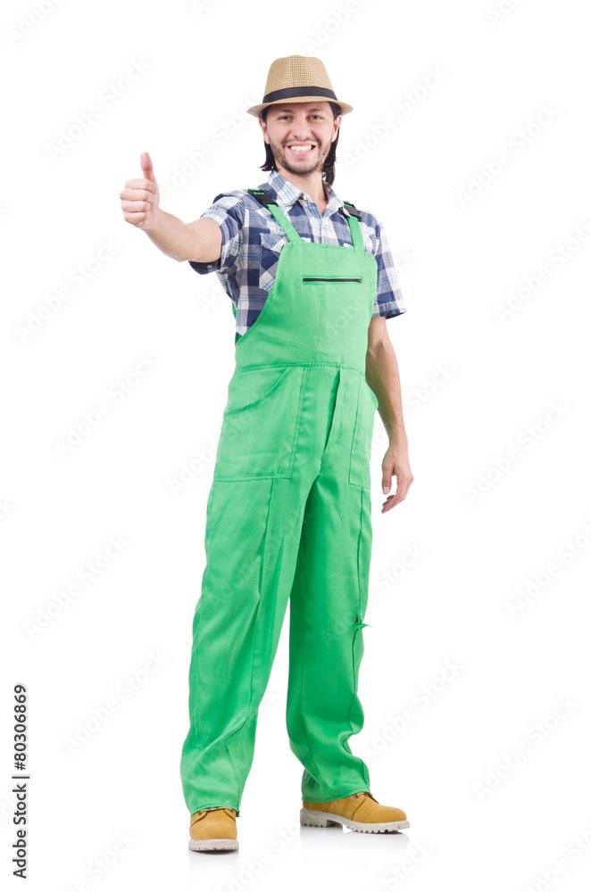 Young cheerful gardener in hat and green uniform isolated on Young cheerful gardener in hat and green uniform isolated on