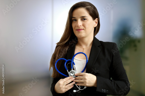 female doctor with stethoscope overmedical  background photo