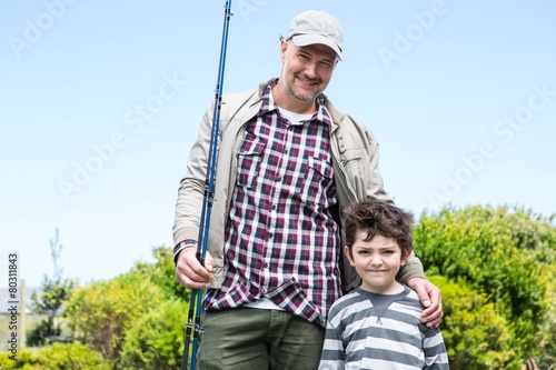 Father and son looking at camera