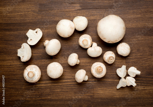 Fresh whole white button mushrooms, or agaricus, on a rustic