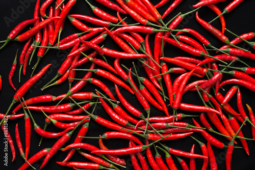 Red chilies on black background