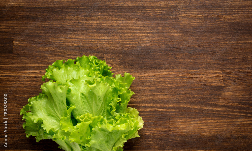 closeup isolate fresh lettuces on wooden desk closeup isolate fresh lettuces on wooden desk