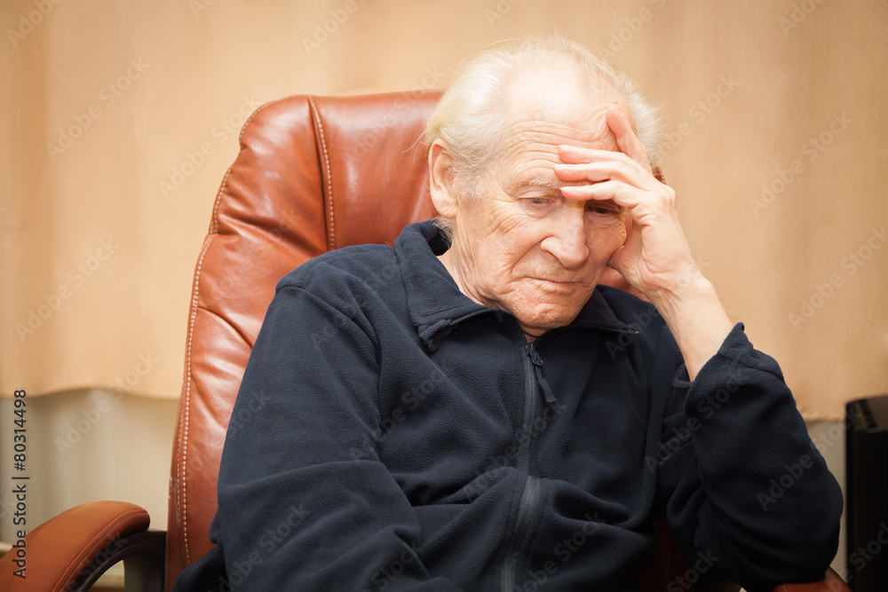 old man pillowes his head on a hand old man pillowes his head on a hand