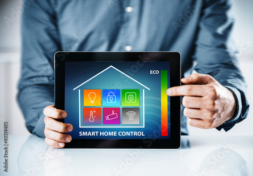 Man pointing to an interface for a smart house