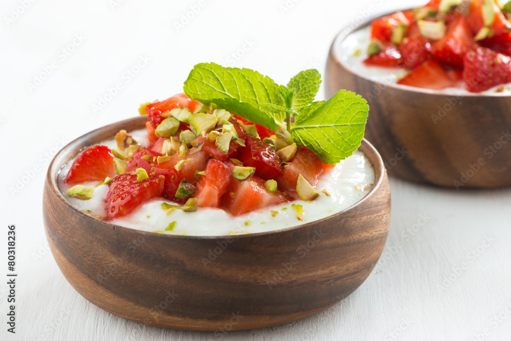 dessert of yogurt with fresh strawberries, pistachios and mint dessert of yogurt with fresh strawberries, pistachios and mint