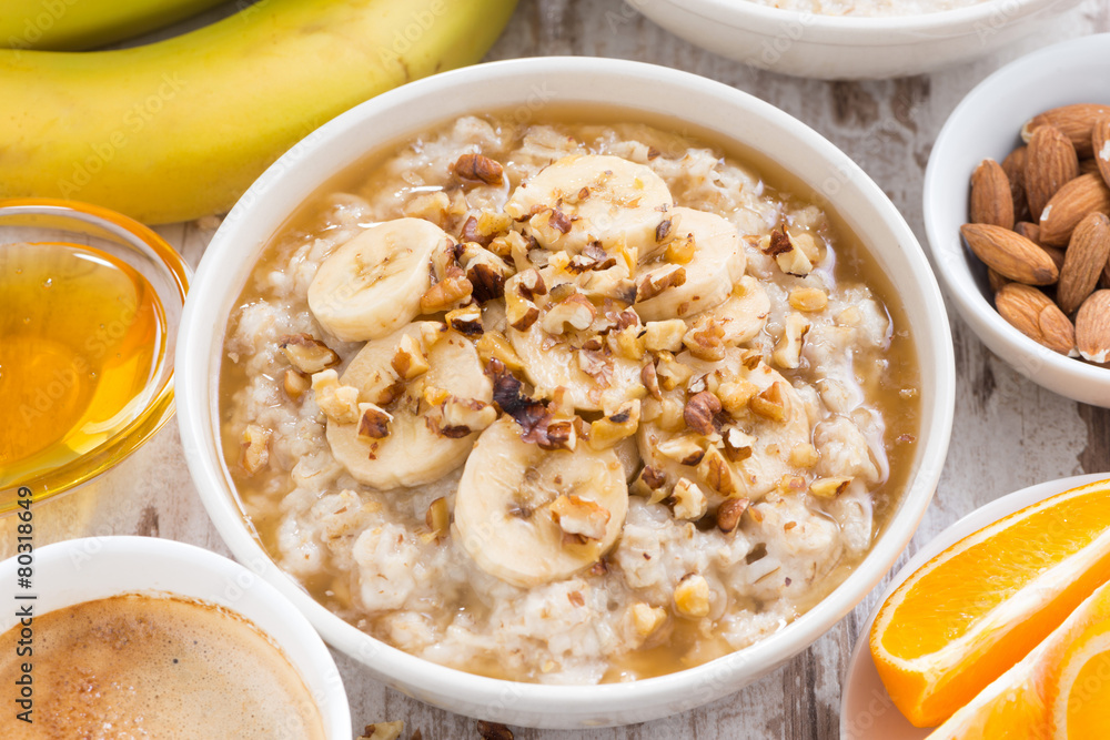 healthy breakfast - oatmeal with banana, honey and walnuts healthy breakfast - oatmeal with banana, honey and walnuts