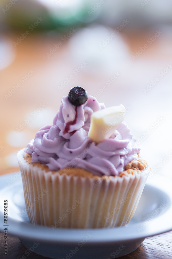 Cute cupcake with blueberry cream Cute cupcake with blueberry cream