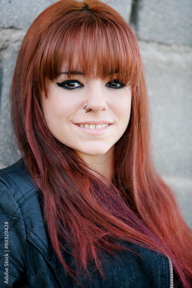 Naklejka premium Rebellious teenager girl with red hair