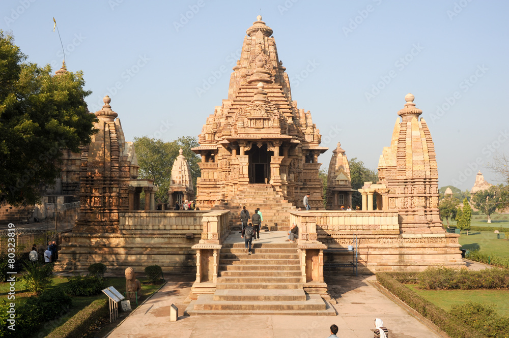 People climb to the hindu temple of Khaiuraho on India