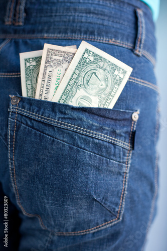 one dollars banknotes in a pocket of jeans