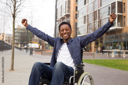 happy wheelchair user celebrating a success.