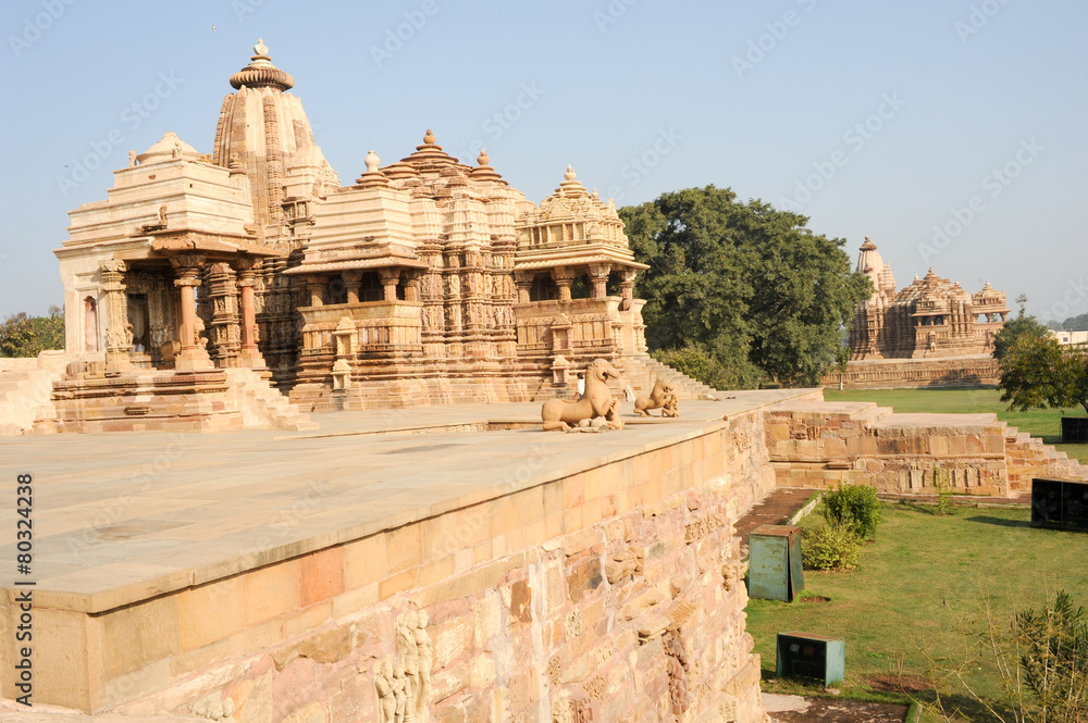 People climb to the hindu temple of Khaiuraho on India