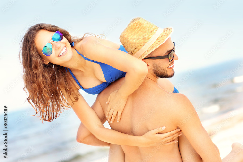 Young couple having fun at the beach Young couple having fun at the beach