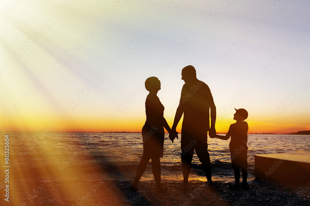 Family vacation. Sunset at sea. Silhouette