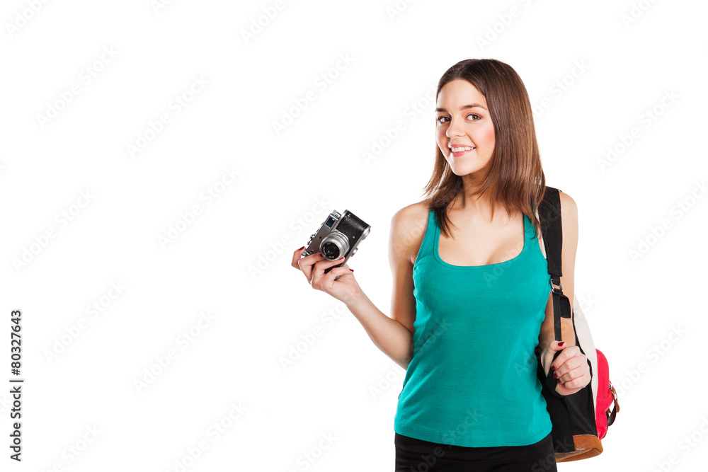 Beautiful young female student posing with notebooks and camera Beautiful young female student posing with notebooks and camera