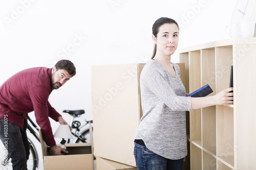 beautiful young couple unpacking at new home