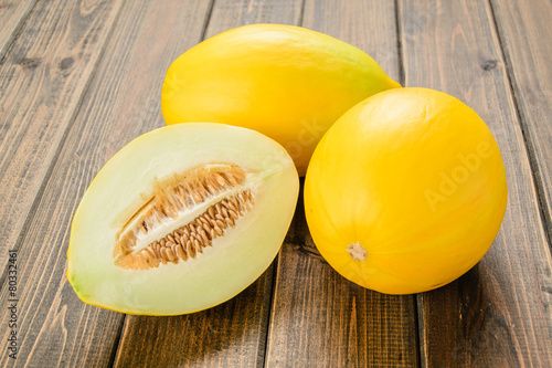 yellow melon on the wooden board
