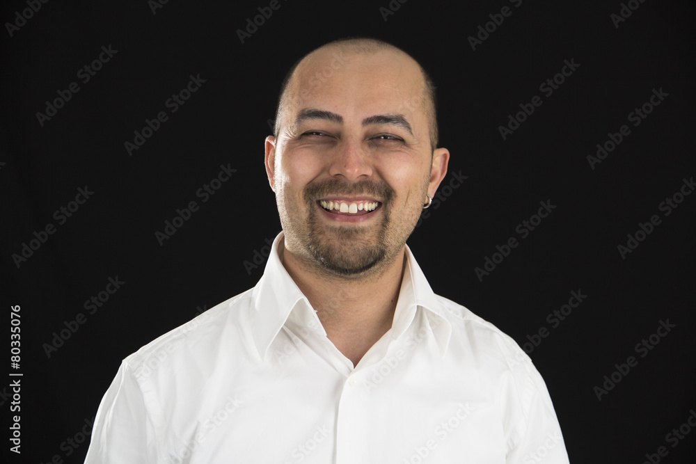 happy young man smiling at the camera isolated on black backgrou happy young man smiling at the camera isolated on black backgrou