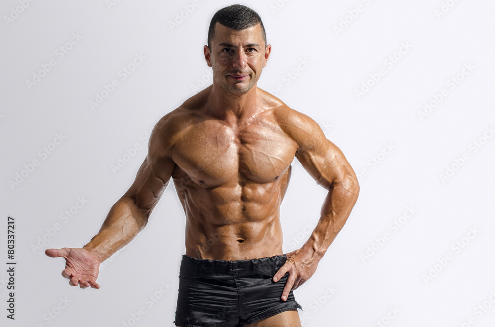 Strong bodybuilder with six pac, shoulders,biceps, triceps,chest Strong bodybuilder with six pac, shoulders,biceps, triceps,chest
