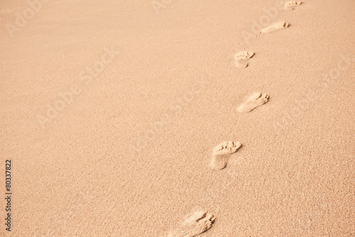 Human footprints on beach sand